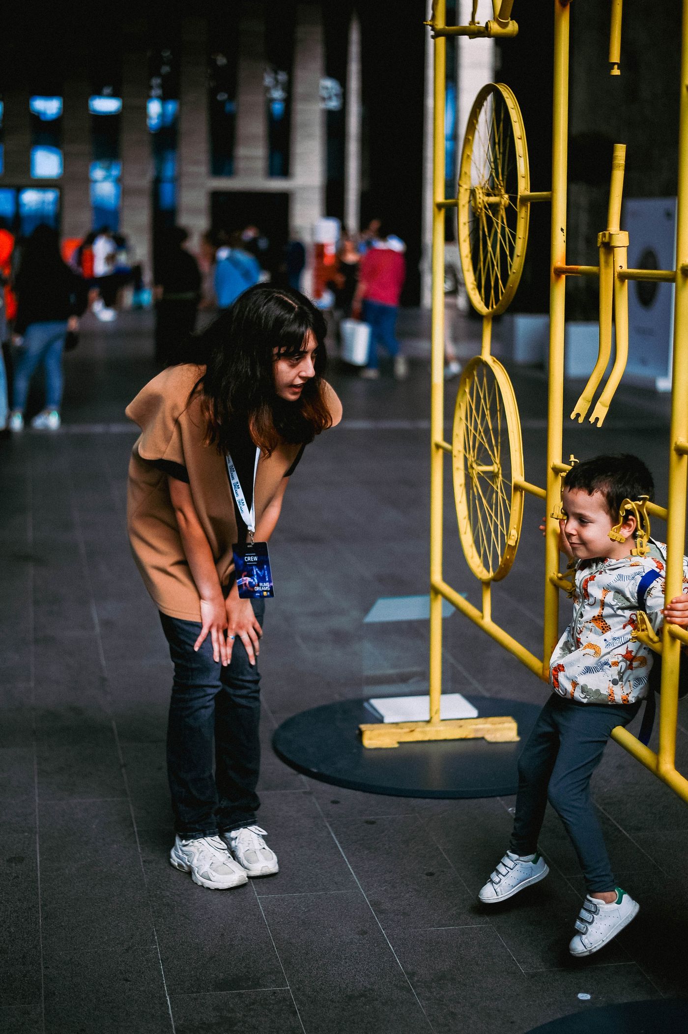 An adult and child examining an exhibit in a museum
